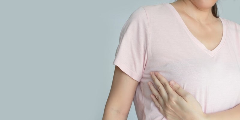 Woman experiencing early pregnancy symptoms after embryo transfer at 7 days.